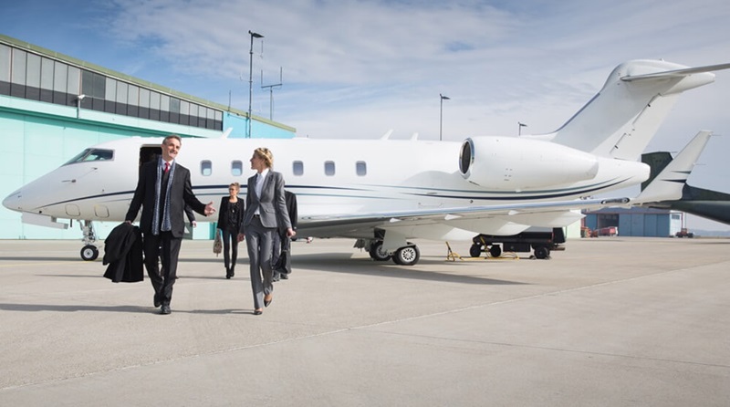 business team leaving corporate jet